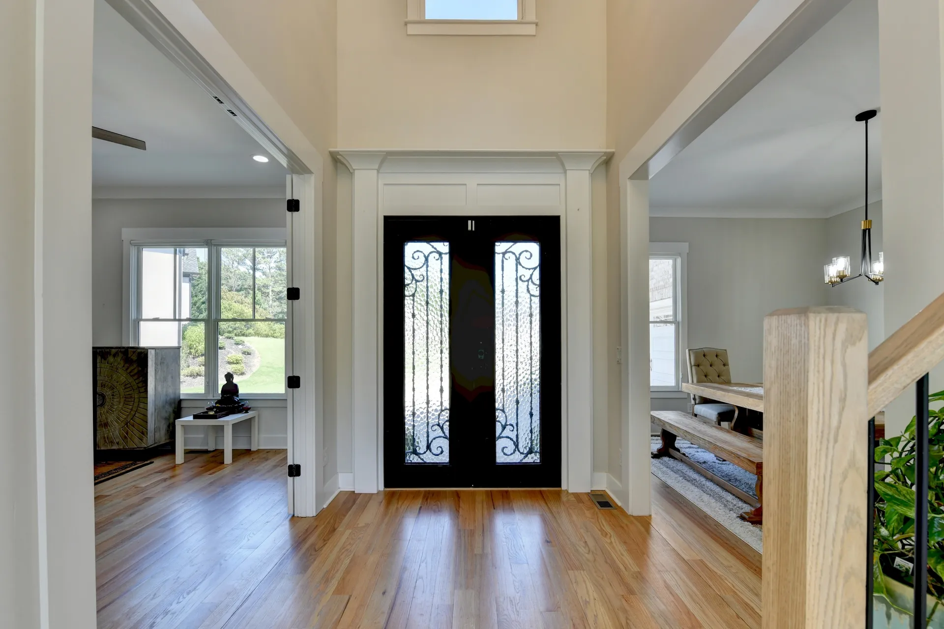Two-story foyer with double iron doors